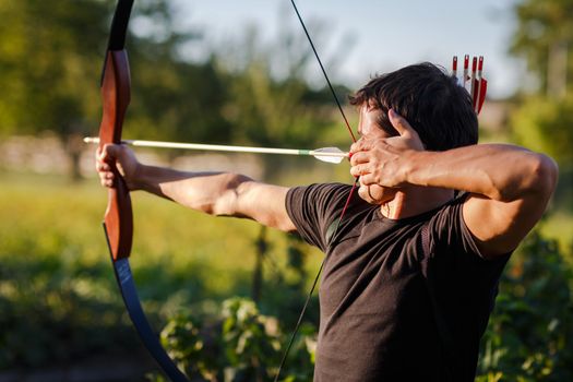 Young archer training with the  bow