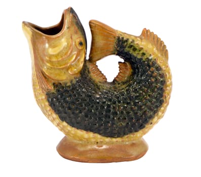 Fish figure sculpture made of clay isolated on white background. Homemade decoration.