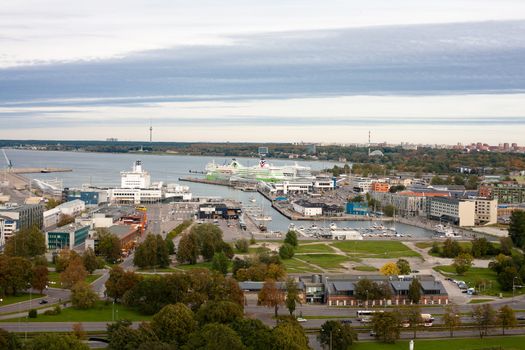 A Tallin view with modern buildings and sea 
