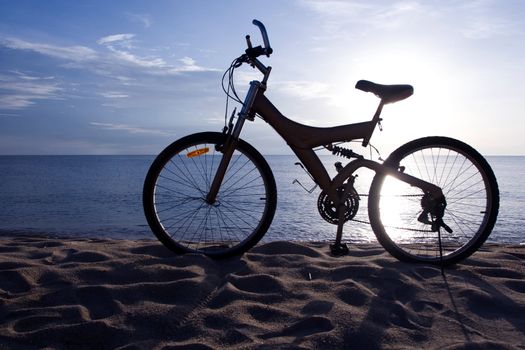 Silhouette of a Bike on the Beach