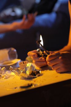 Young man preparing a joint