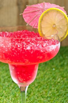 Strawberry Watermelon Daiquiri decorated in front of a timber wall