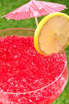 Strawberry Watermelon Daiquiri decorated in front of a timber wall