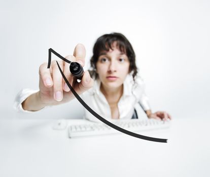 concentrated woman with a pen drawing a uptrend chart on screen