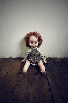 Creepy Vintage Doll on wooden floor