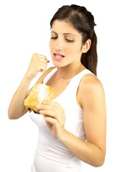 Young woman ready to punch sweet snack to protect her diet