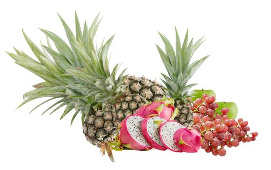 Fresh mix fruits over white background , pineapple ,dragon fruits, apple and grape