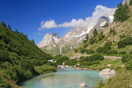 beautiful stream between rocks in Veny valley, Courmayeur. Italy