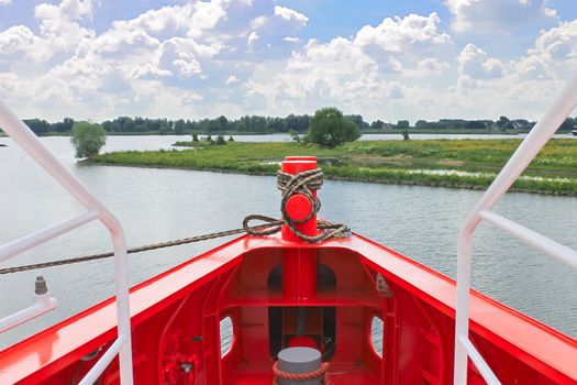 Bow of new red ship at the port