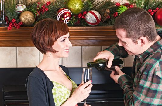 Smiling young couple enjoying a glass of wine