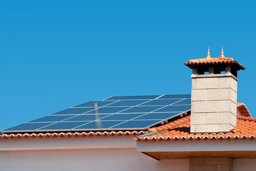 Roof of a house equipped with a solar panel