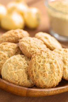 Peruvian cookies made with powdered maca or Peruvian ginseng (lat. Lepidium meyenii), with fresh maca roots and maca flour in the back (Selective Focus, Focus on the front of the cookies)