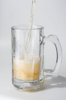 Mug, full of cold lager beer. Isolated.