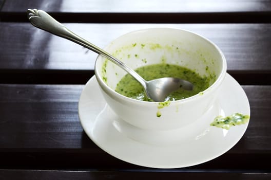 Spinach soup on the wooden table