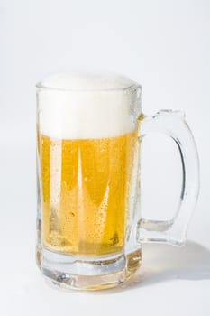 Mug, full of cold lager beer. Isolated.