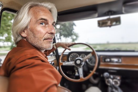 An image of a handsome male portrait with white beard