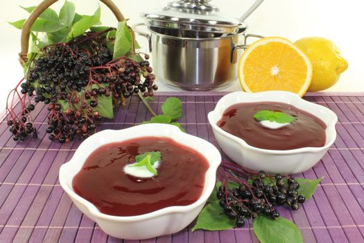 a bowl with Elderberry soup of fresh elderberries