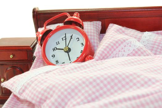 Sleepy - alarm clock in bed with bedside and plaid bedding