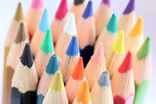 An extreme macro view of colour pencils arranged in a row