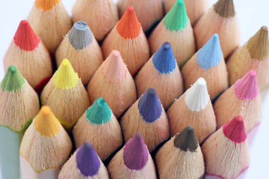 An extreme macro view of colour pencils arranged in a row