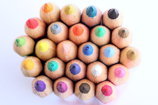 An extreme macro view of colour pencils arranged in a row