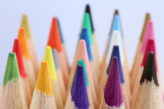 An extreme macro view of colour pencils arranged in a row