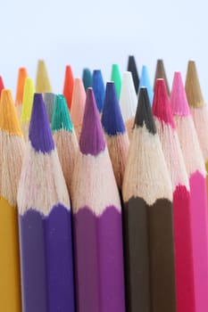 An extreme macro view of colour pencils arranged in a row