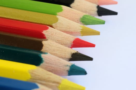 An extreme macro view of colour pencils arranged in a row