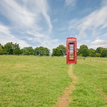 A British Telephone Booth Standing Alone in the Countryside