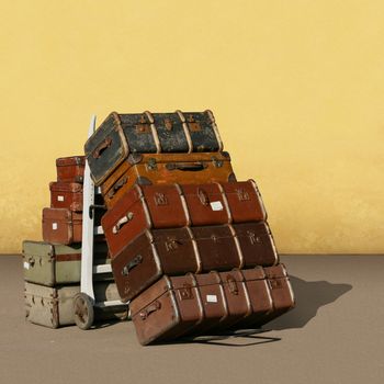A Pile of Old Vintage Suitcases - Luggage 