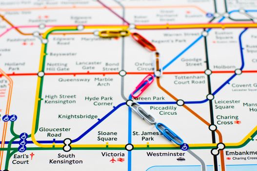 Variegated paperclips on the map of London metro