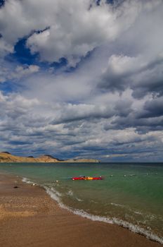 View of thunderstorm clouds above the sea