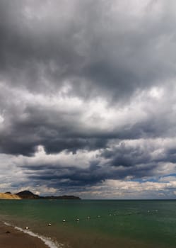 View of thunderstorm clouds above the sea