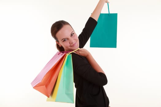 Young woman with colorful shopping bags isolated