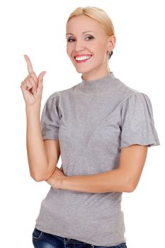 happy young business woman pointing at something interesting against white background