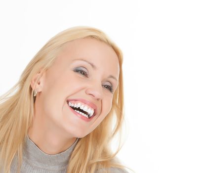 excited young woman laughing against white background