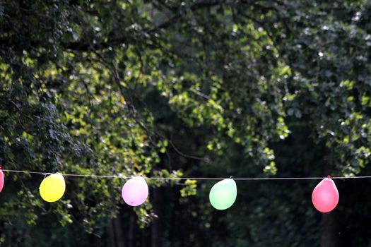 colorful party balloons on a rope