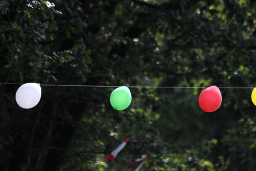 colorful party balloons on a rope