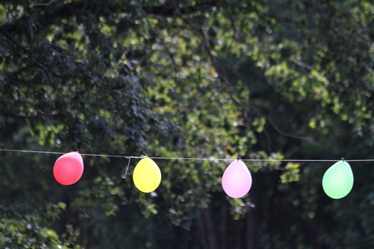 colorful party balloons on a rope