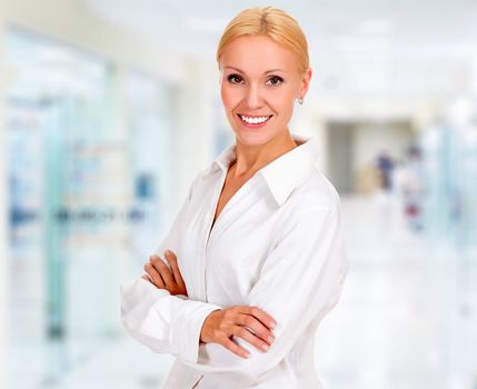 young business woman in the office smiling to you