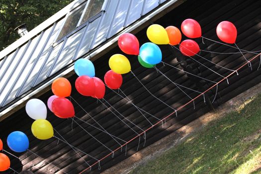 colorful party balloons on a rope