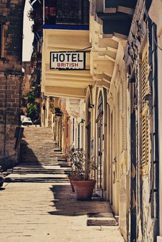 Very old run down hotel sign in Valetta, Malta. 