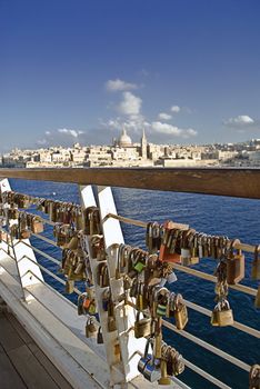 Locks on a fence in Malta, symbolising love.