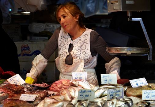 BARCELONA - MAY 26: The market fish monger lady on May, 26, 2012 in Barcelona, Spain.