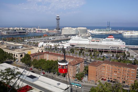 BARCELONA - MAY 27: Barcelona aerial view with funicular and sea port on May, 27, 2012 in Barcelona, Spain.