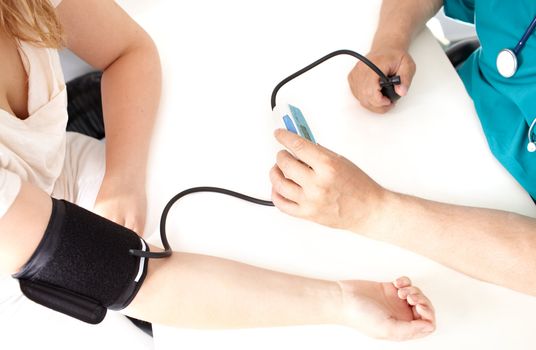 Professional check of blood pressure in a medical study.