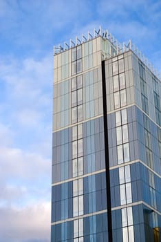 Modern office block against a blue sky. 