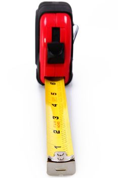 Red, black and yellow tape measure over white background. Focus on number 1 and 2.