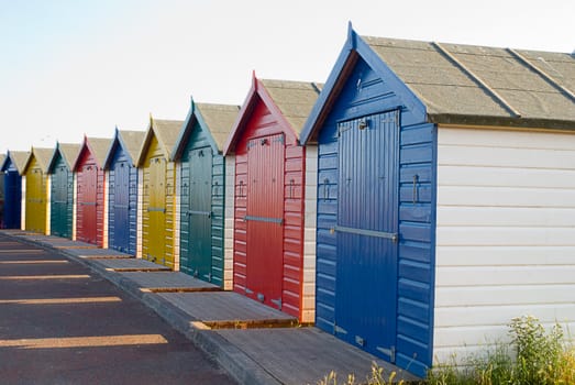 Neat row of beach huts in Devon, UK