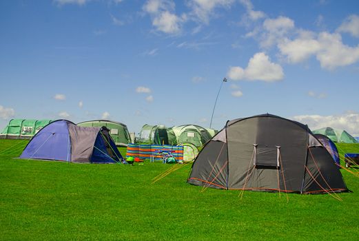 Various tents on a campsite.